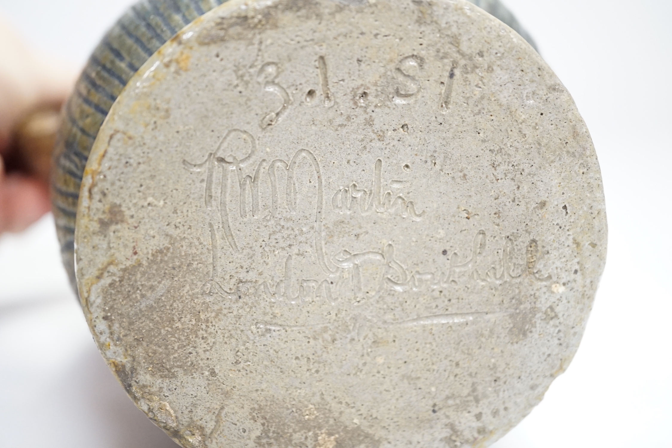A R W Martin Brothers, London and Southall stoneware jug, repaired, mark to base, 22cm high